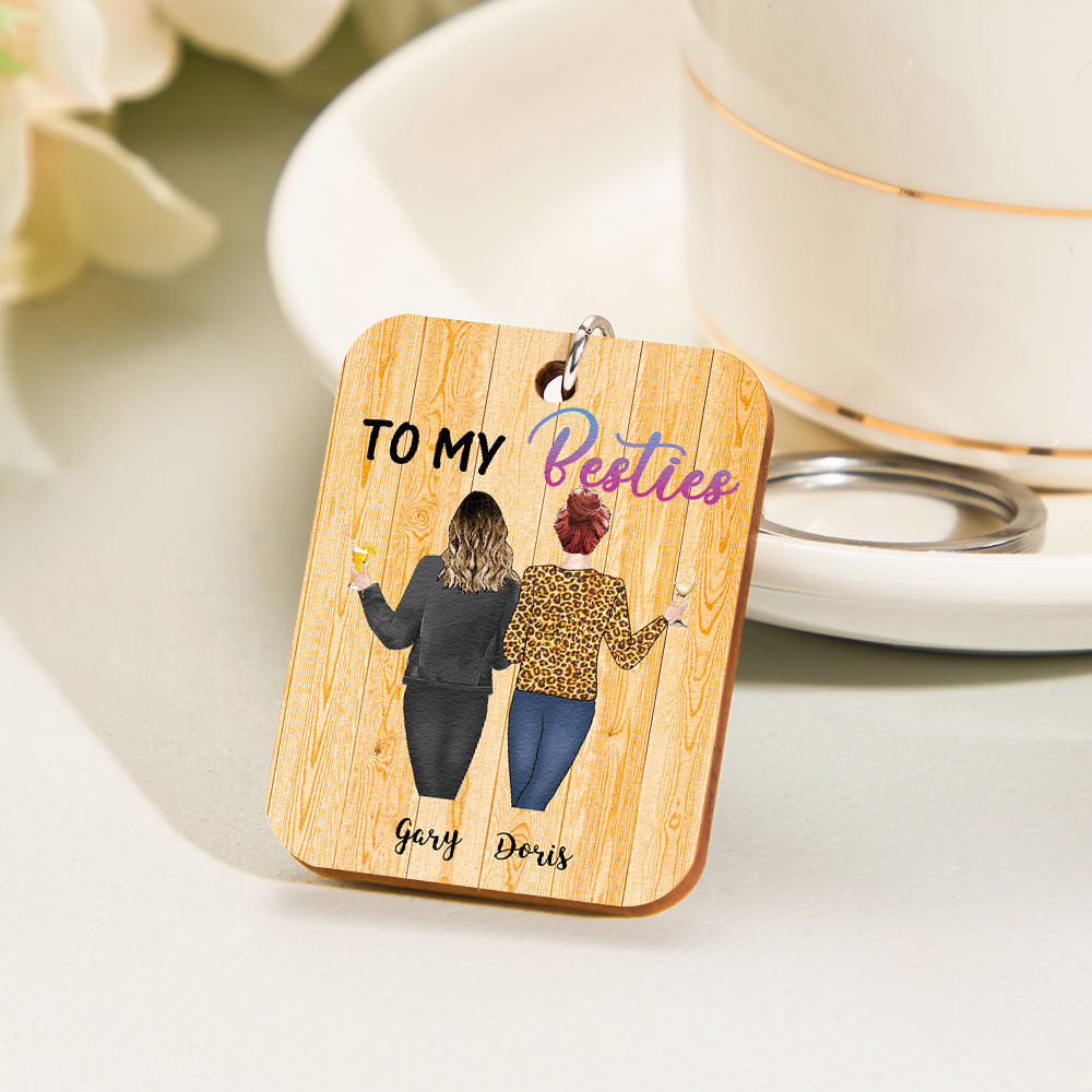 Wooden personalised cartoon back-view keyring on a bag — custom engraved keychain ideal as a personalised graduation gift or Mother's Day present