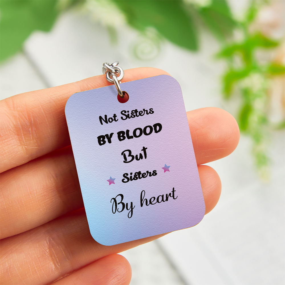 Close-up of personalised sister back-view engraving on wooden keyring with sturdy ring — custom sister keyring, gifts for sisters
