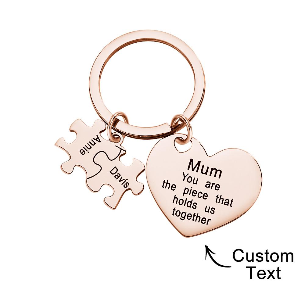 Detail of metal keyring and puzzle join on personalised engraved heart keychain — close-up of hardware and engraving finish