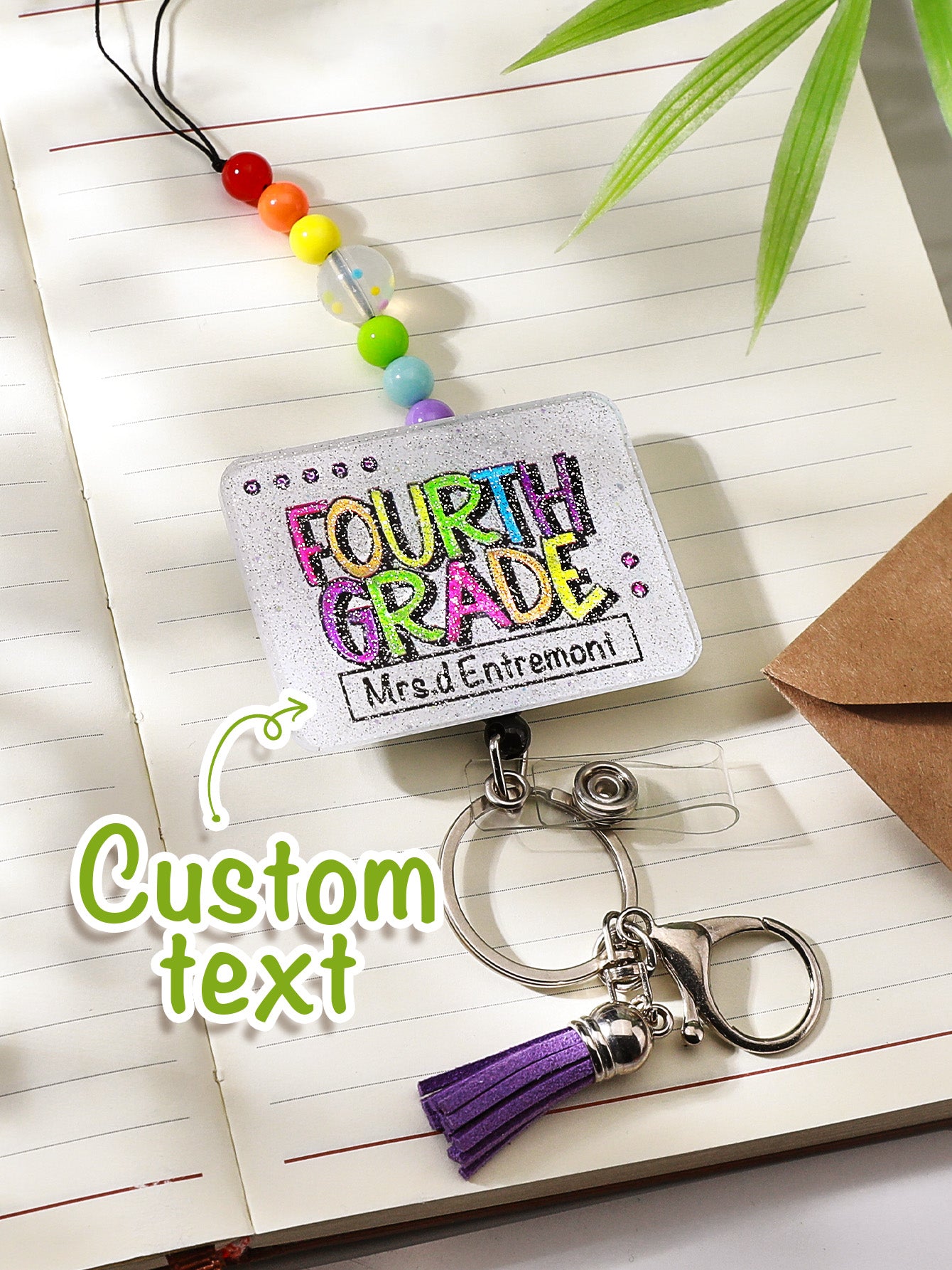 Personalised lanyard shown with graduation cap prop — ideal personalised graduation gift and keepsake