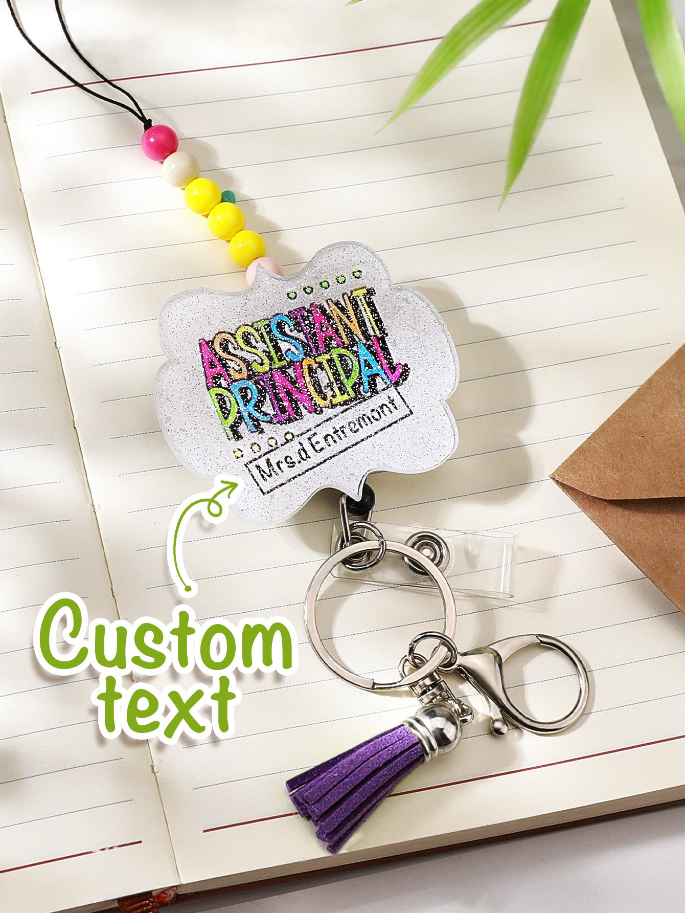 Personalised lanyard coiled around a planner to show scale — 62cm acrylic beaded lanyard for teachers