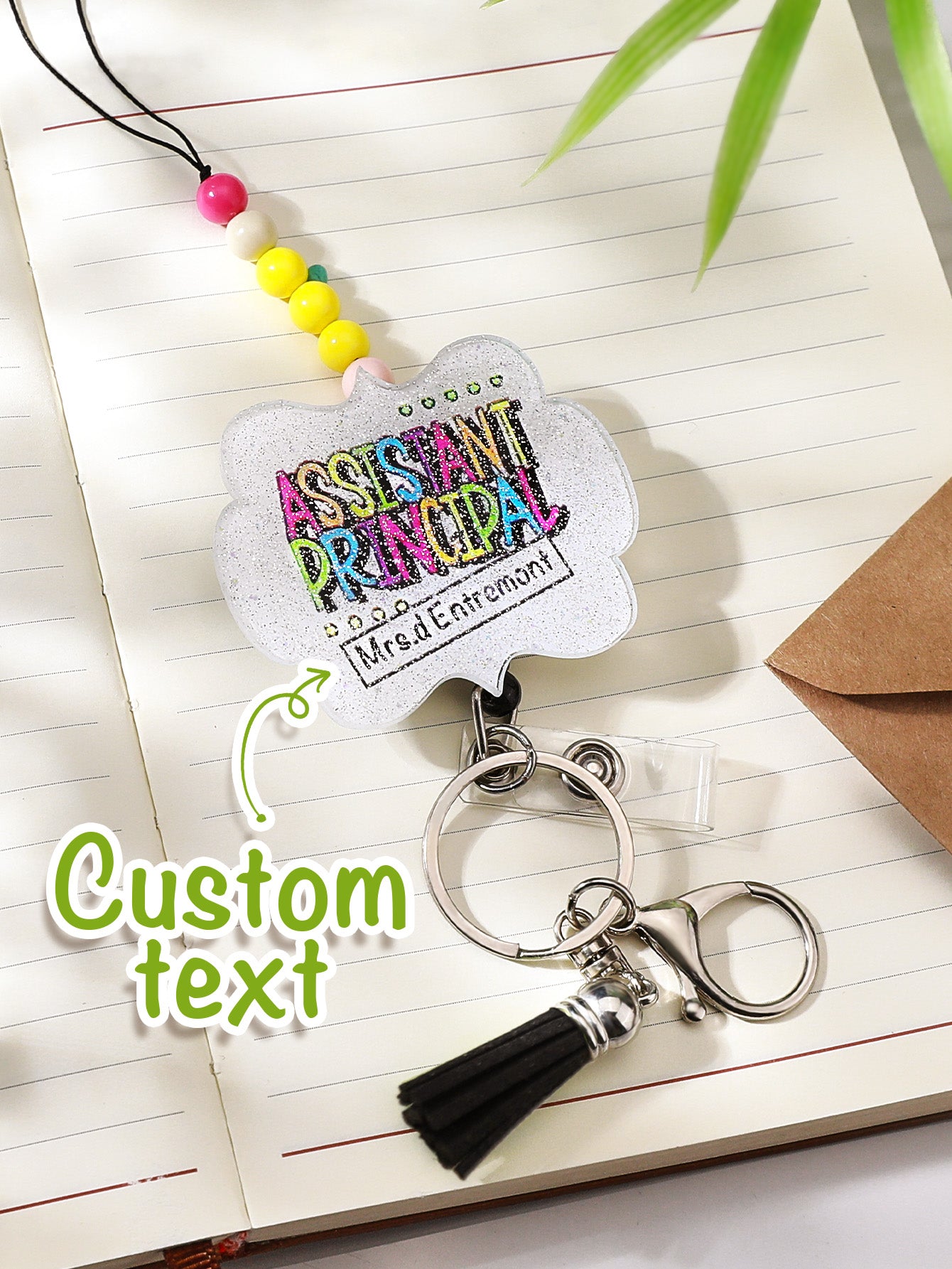Personalised lanyard coiled around a planner to show scale — 62cm acrylic beaded lanyard for teachers