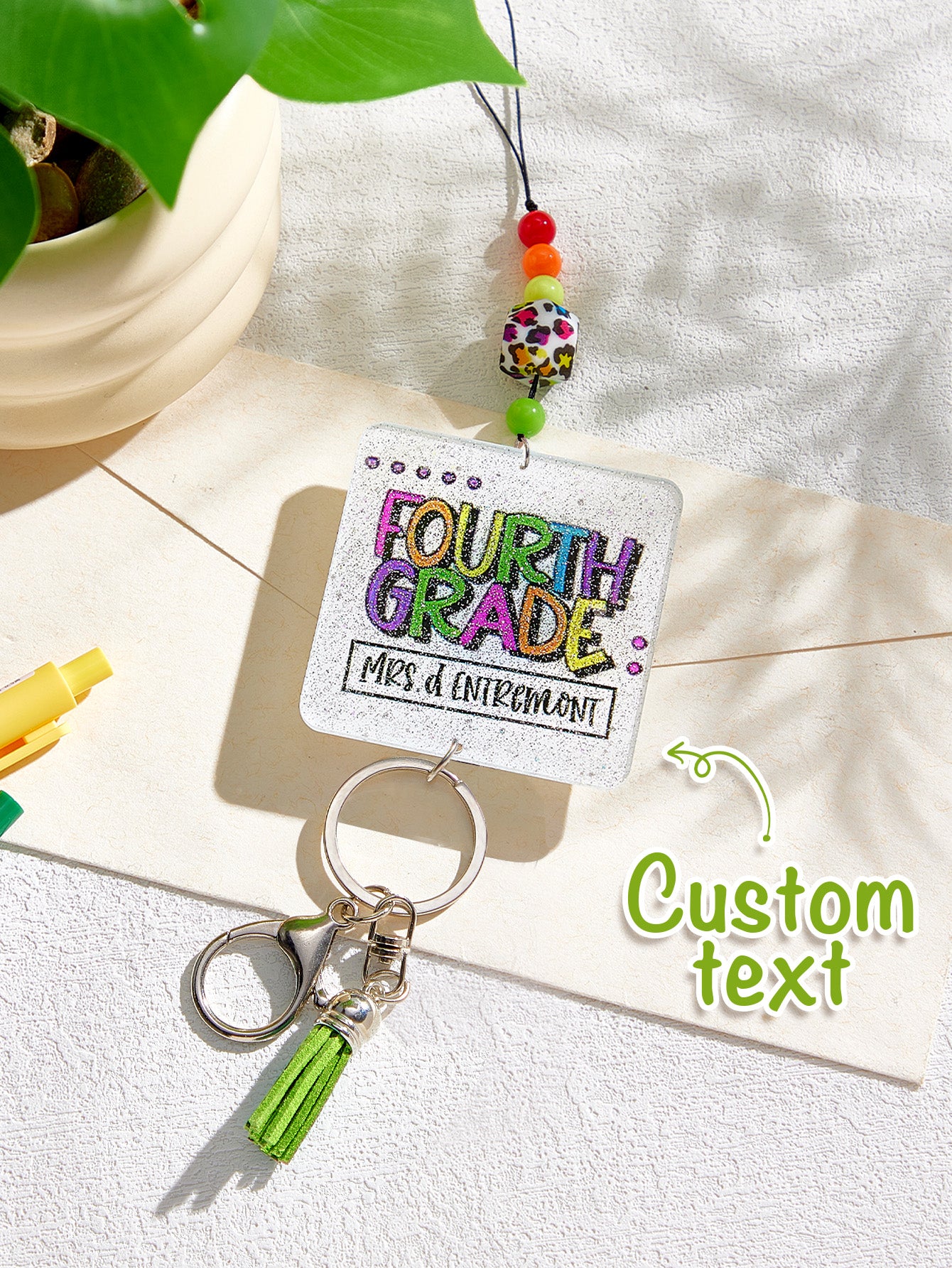 Close detail of clasp and lower ring on personalised glitter tassel lanyard — secure attachment for keys and cards