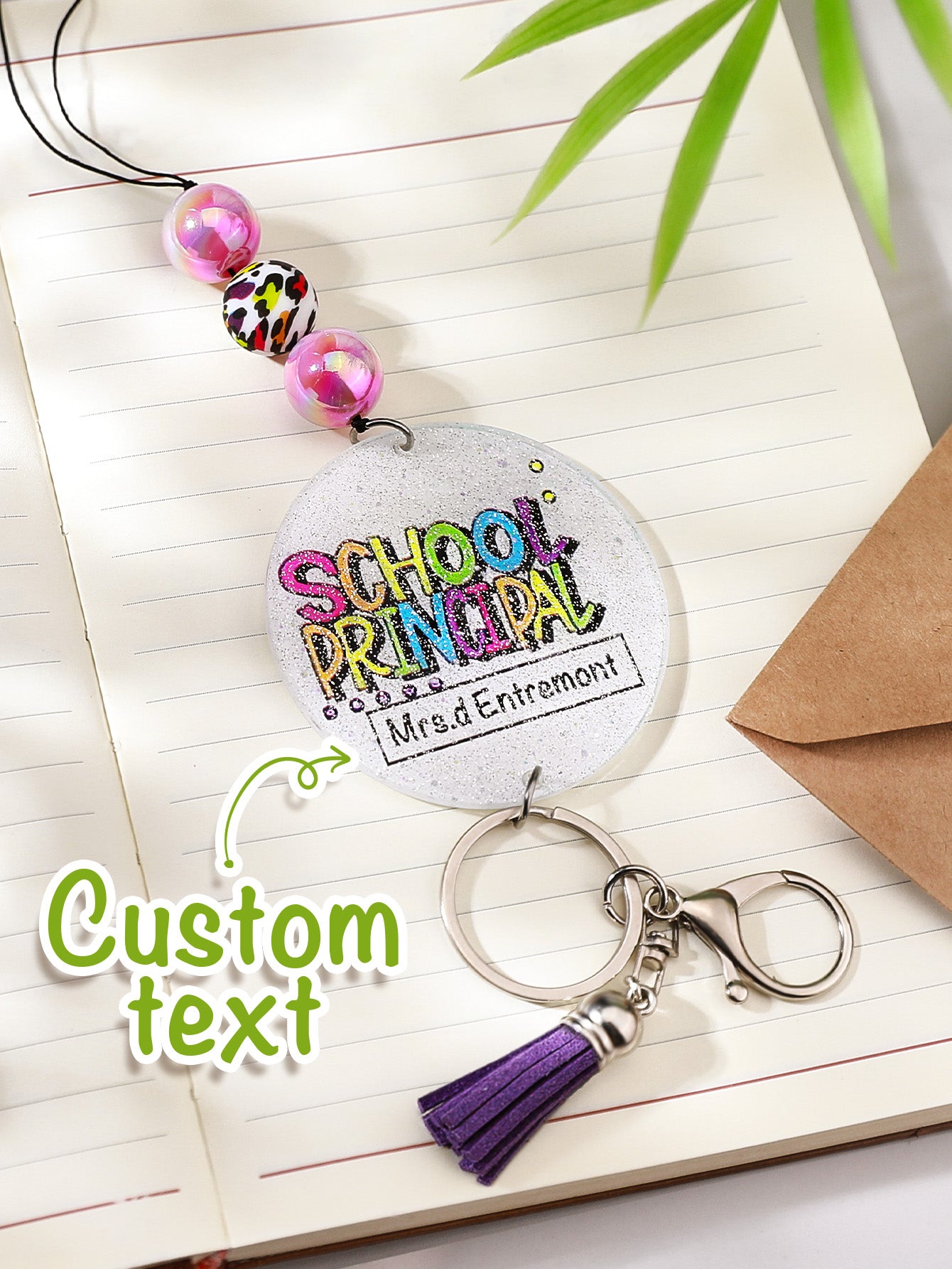 Detail of glitter finish on acrylic beads with personalised charm — sparkling personalised lanyard for teachers