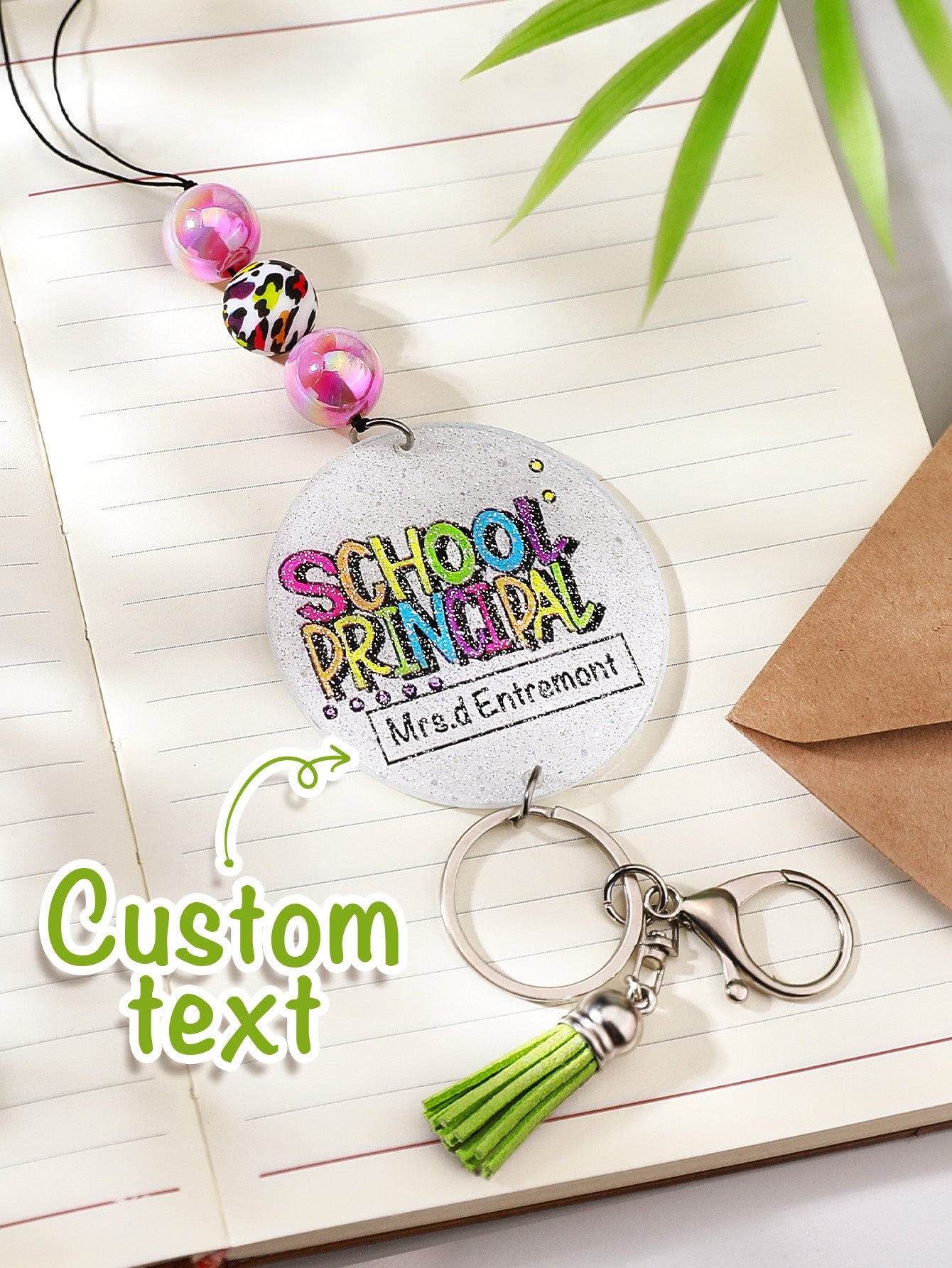 Tassel and bead end detail on personalised glitter lanyard — decorative acrylic beaded tassel lanyard feature