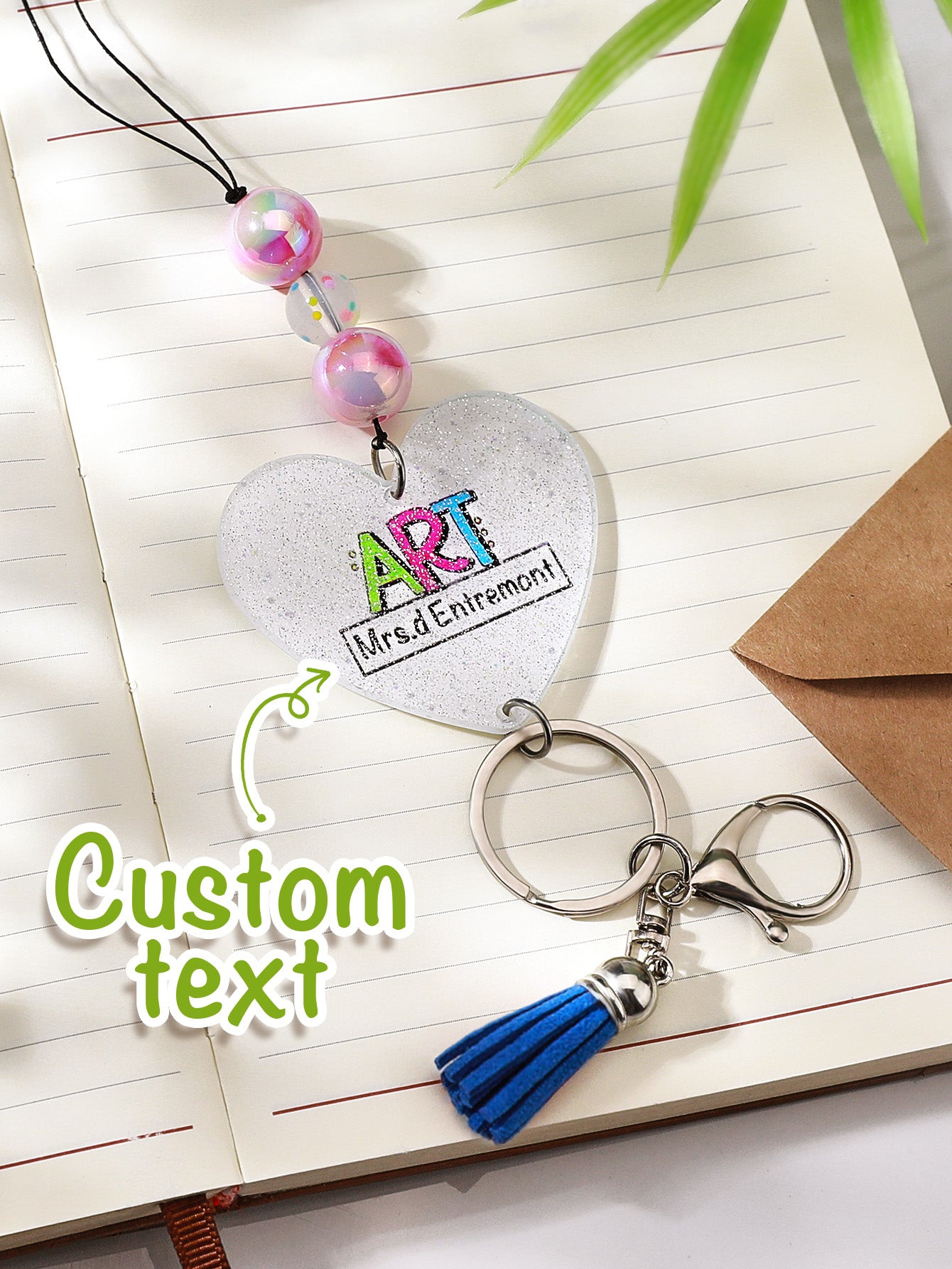 Minimalist flat-lay highlighting tassel silhouette and glitter beads — personalised glitter tassel lanyard styling