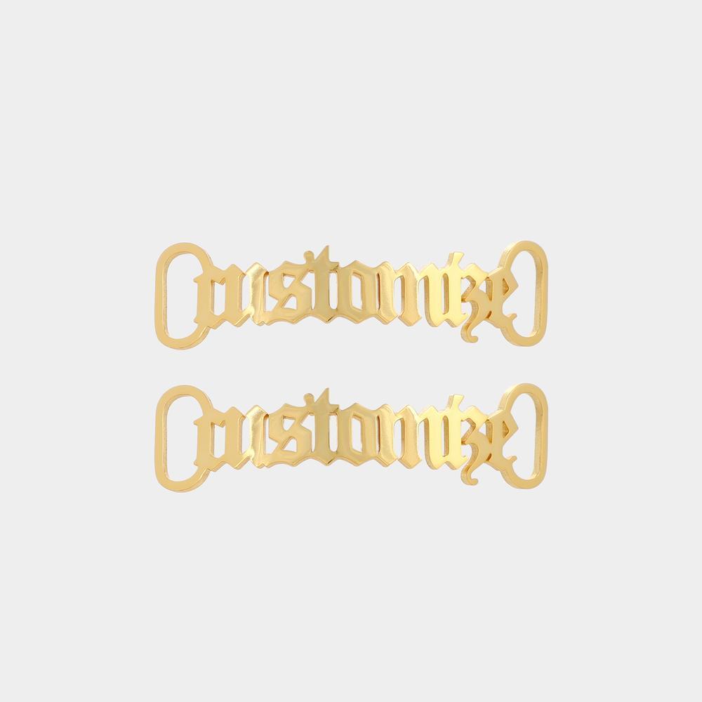Gold personalised name metal shoelace charm threaded on trainer laces, custom shoe buckle detail