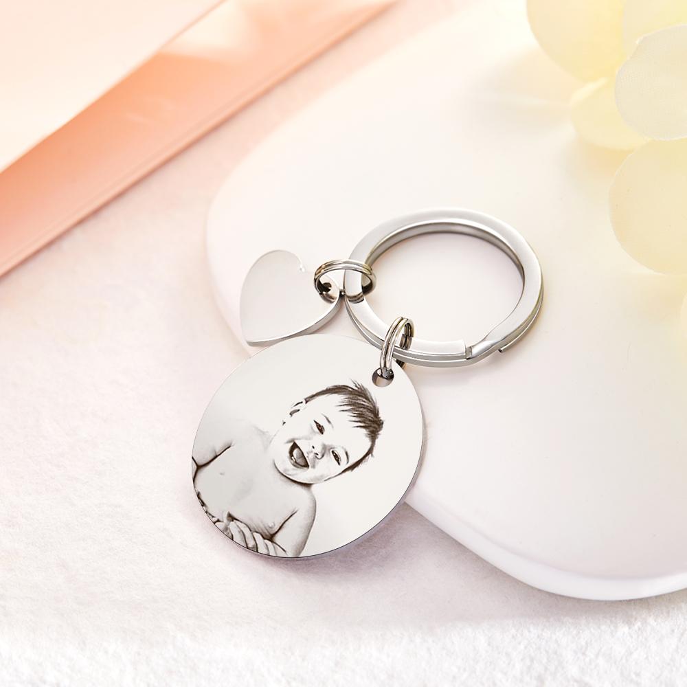 Close-up of personalised photo engraved keyring — durable stainless steel plated charm with bespoke name, short message or date engraving