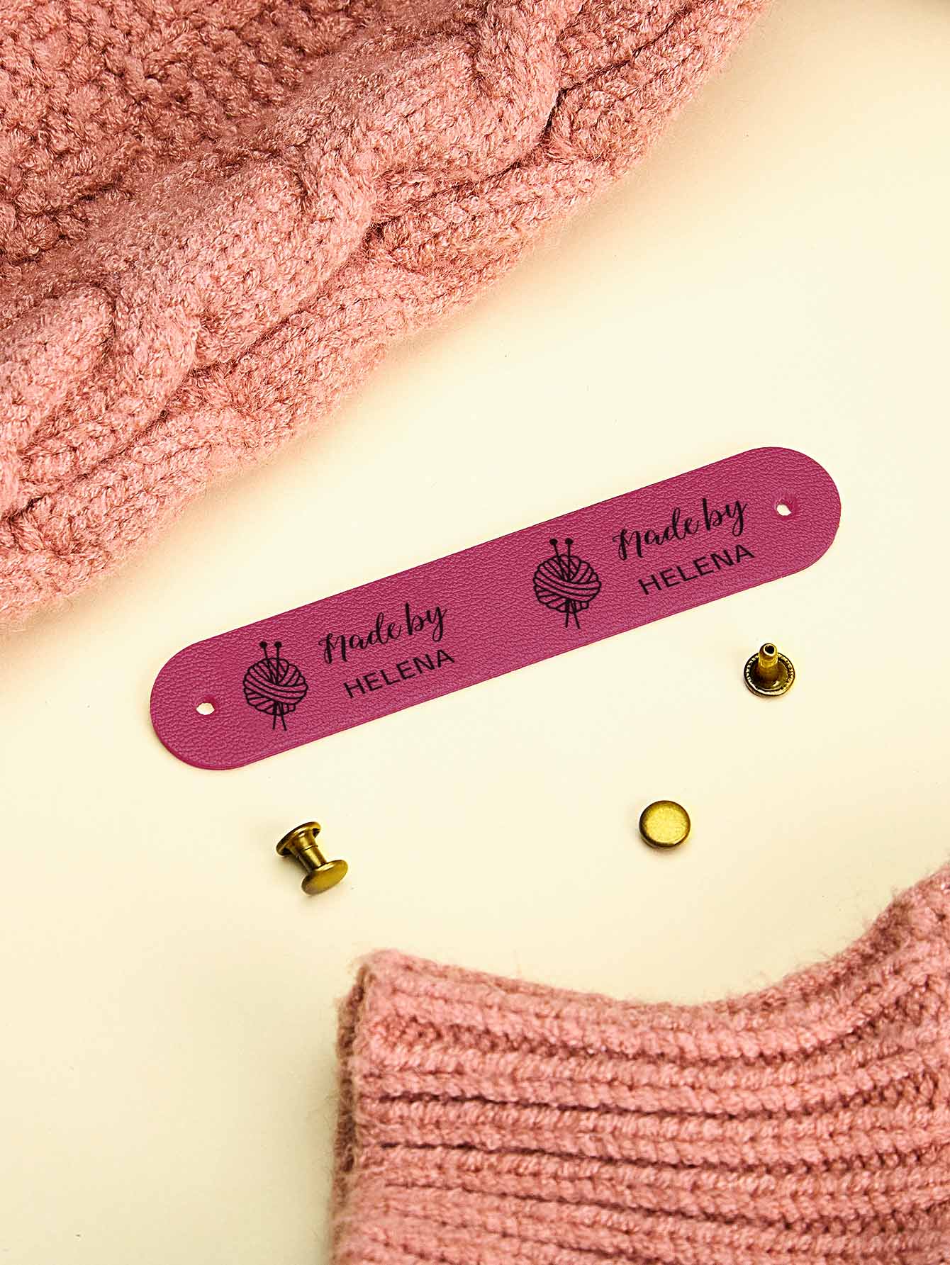 Handmade accessory with a sewn-on personalised PVC label — elegant craft branding