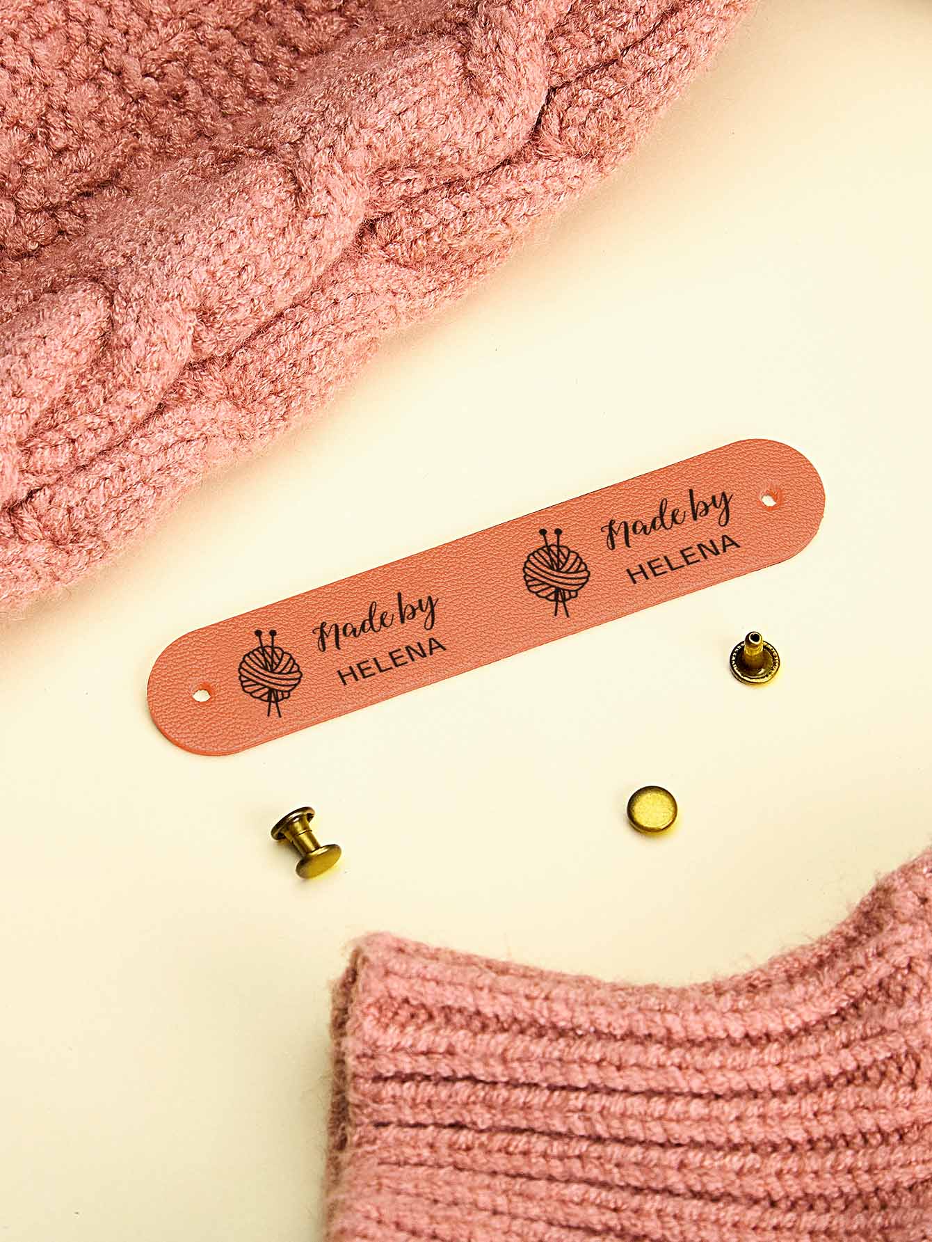 Close-up of custom PVC label edge and engraving detail on a personalised tag