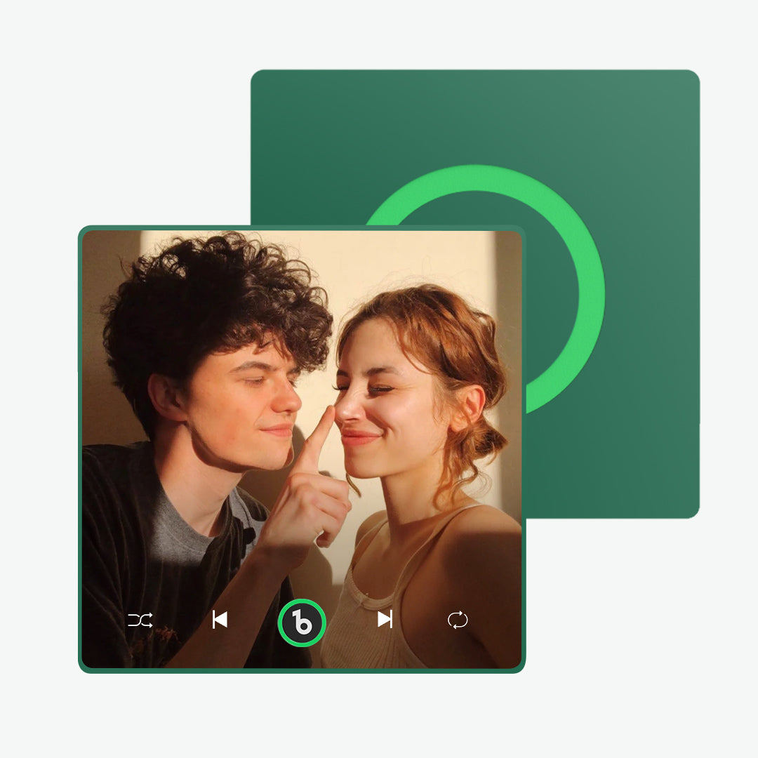 FridgeBeats 4.0 magnet attached to stainless fridge paired to smartphone via Bluetooth, playing a customised MP3 song — personalised kitchen keepsake