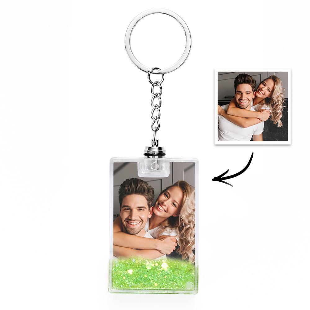 Close-up of custom flowing sand keyring demonstrating mesmerising quicksand motion and crisp personalised photo inside acrylic charm