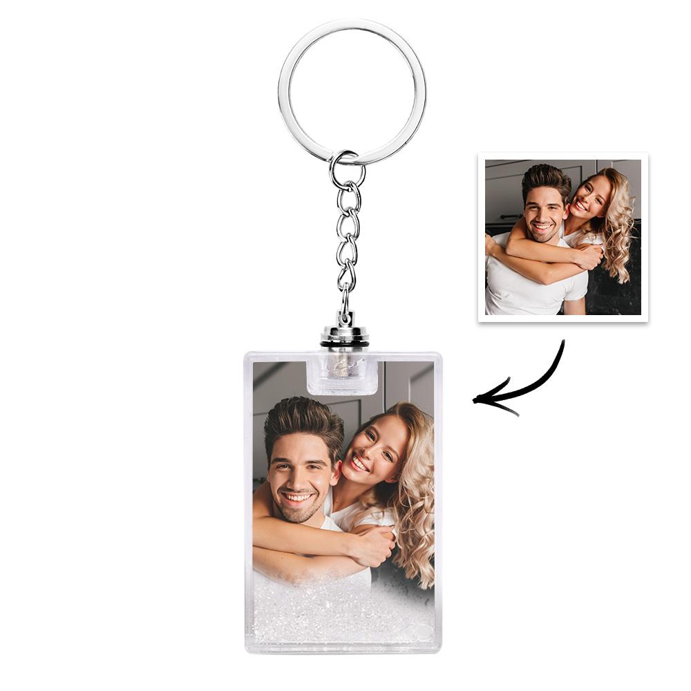 Multiple personalised quicksand keychains arranged to show variety of custom photo options and text engraving possibilities