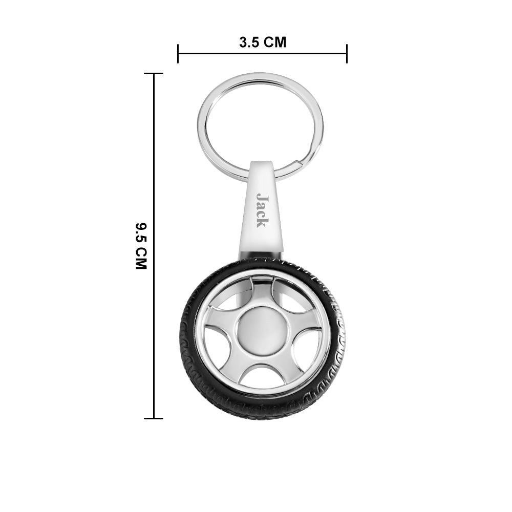 Custom tyre keychain beside standard keys to show pocket-friendly size, durable metal keyring and freely rotating wheel – ideal gift for car lovers