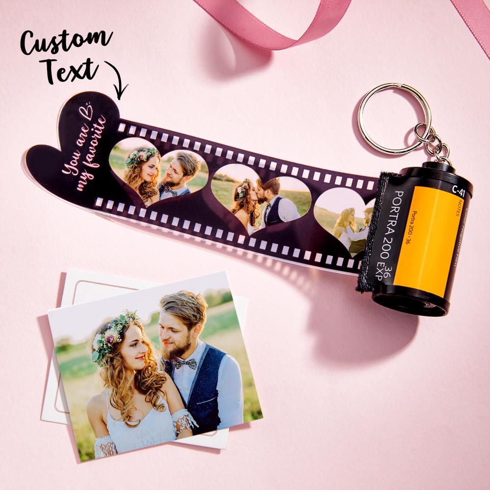 Personalised film photo keychain with a heart camera-roll insert; durable, lightweight plastic protecting a high-resolution photo.
