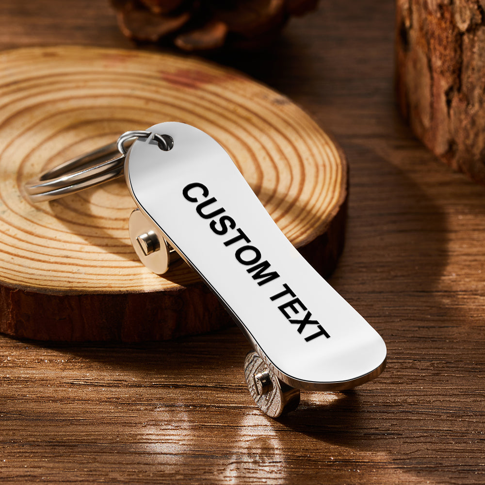 Personalised skateboard keyring close-up — custom engraved stainless steel mini skate deck keychain with realistic deck and wheel detail, ideal for skaters and skateboard lovers
