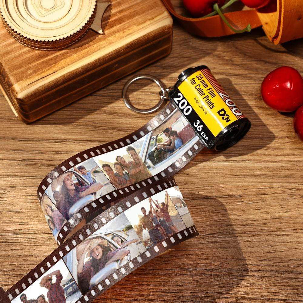 Eco-friendly film roll keyring on a plain backdrop, emphasising recycled film and personalised photo options.