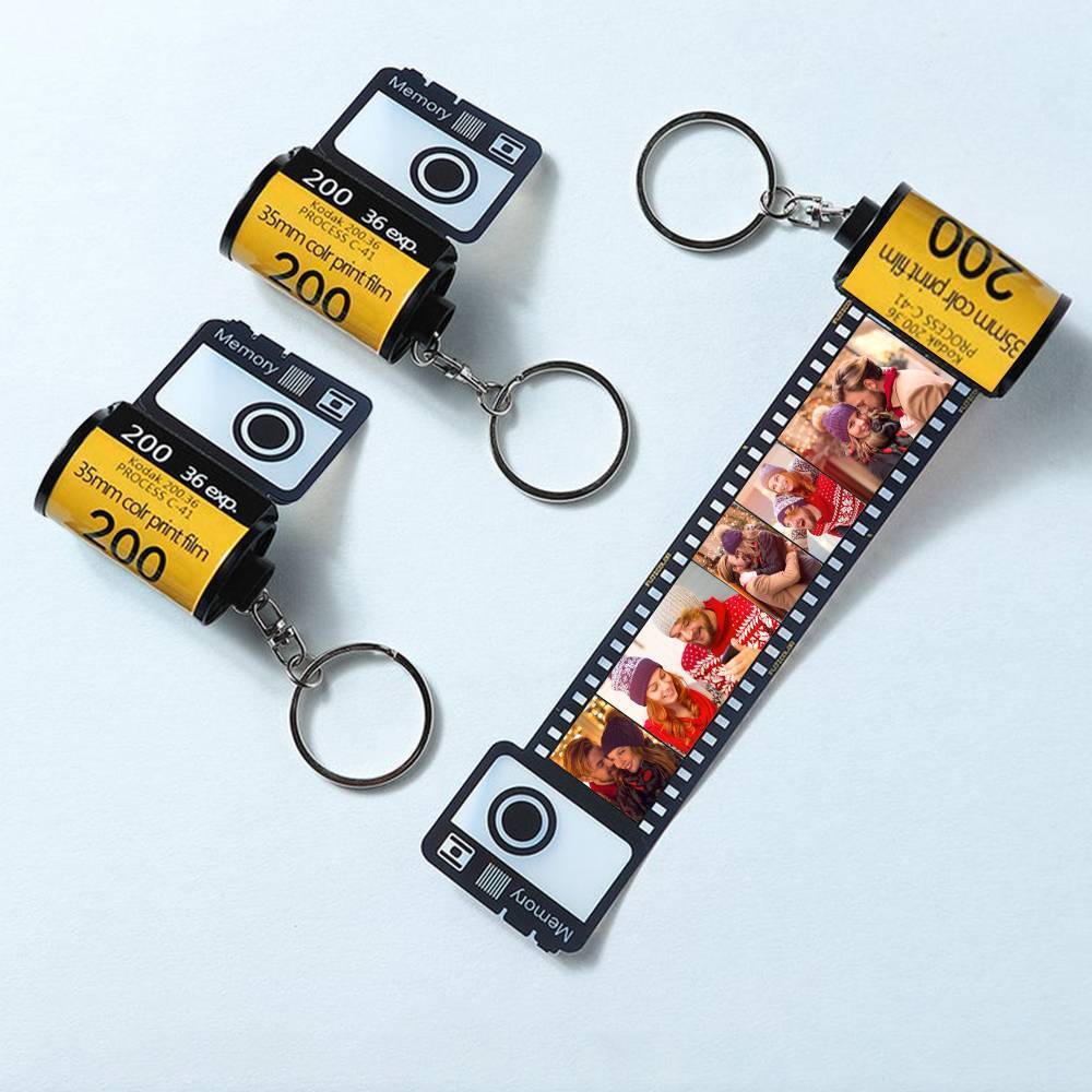 Side view of the personalised photo film roll keyring showing the film-strip design and secure metal ring.