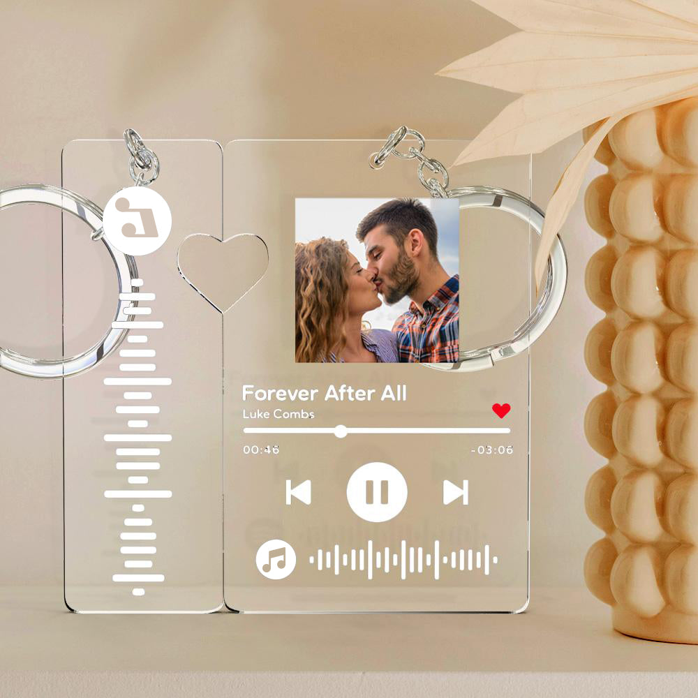 Personalised photo music keyring beside smartphone scanning the unique music code — custom scannable song keychain for couples