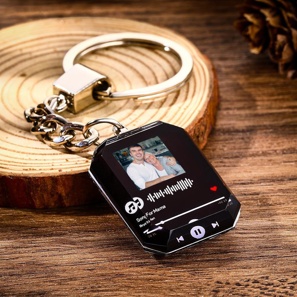 Detailed engraving on crystal keyring showing photo and scannable music code — anniversary gift idea