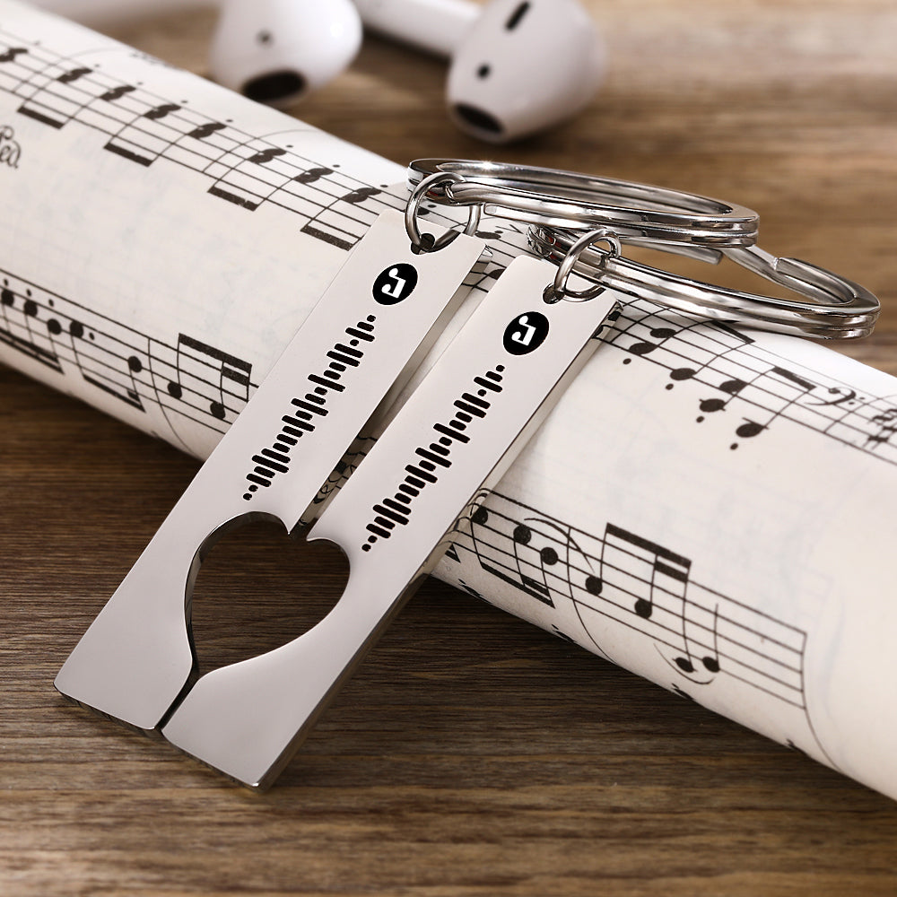 Close-up of precision laser engraving showing the scannable music code on a stainless steel Custom Music Code Keychain