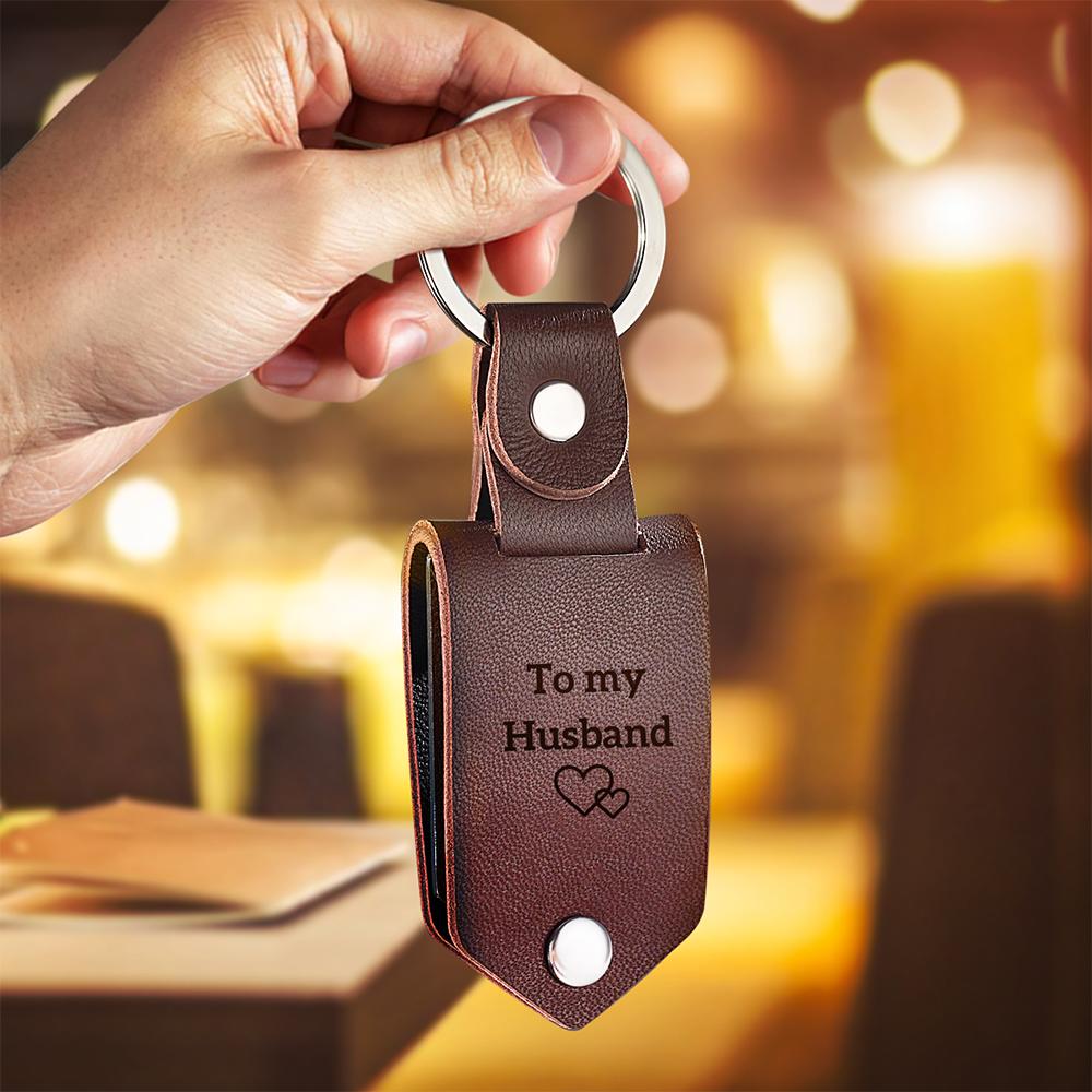 Personalised photo keyring next to keys to show size; stainless steel photo plate, 3cm keyring diameter and durable everyday design