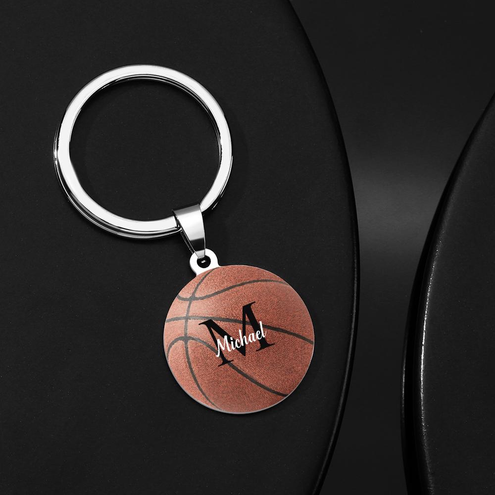 Close-up of personalised basketball keyring showing custom engraved name on stainless steel surface – ideal sports gift for players and coaches