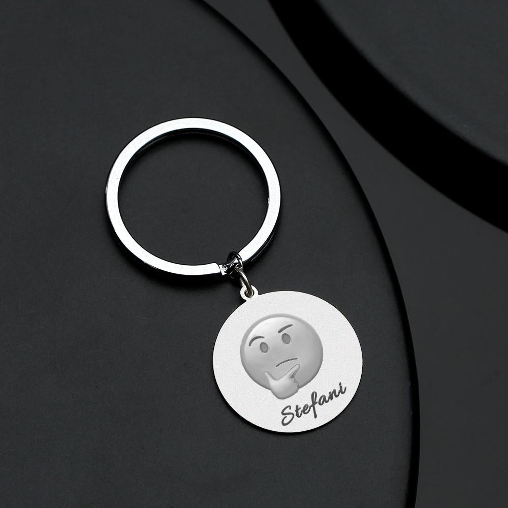 Array of personalised emoji keychains in stainless steel displaying multiple emoji designs and custom text options — ideal personalised gifts and quirky keyrings