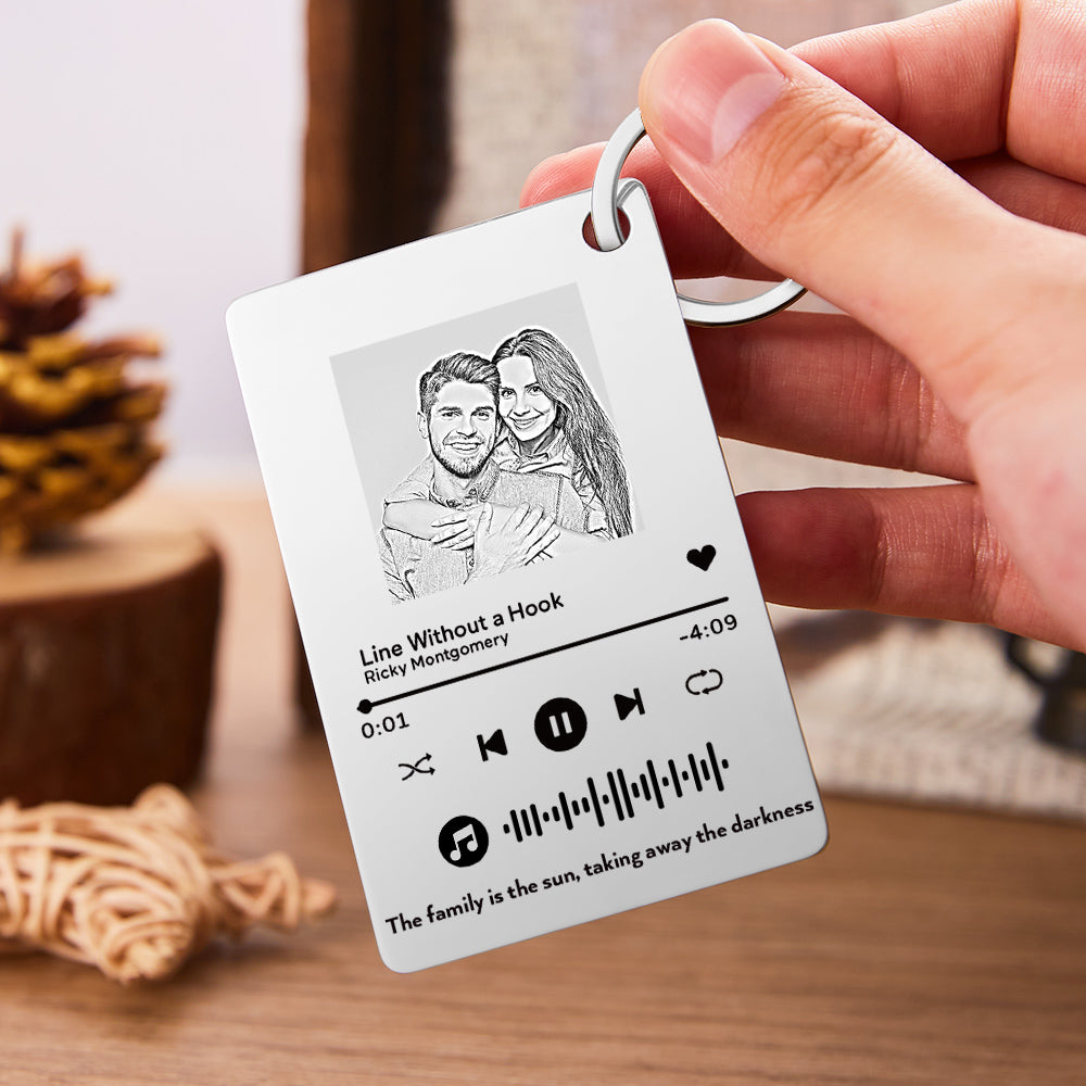 Personalised music code keyring laid flat showing durable, tarnish-resistant stainless steel finish and precision engraved scannable music code