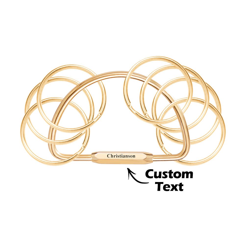 Personalised memorial keyring with multiple engraved names on layered brass-style discs — thoughtful engraved keyring for grandparents and loved ones.
