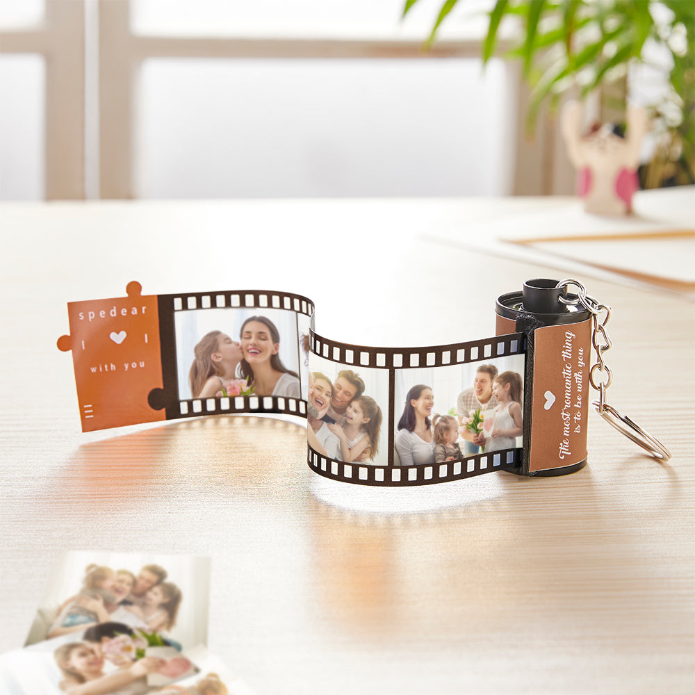Close-up of personalised film roll keychain with red-heart accent and visible multi-photo insert – custom text option for name or short message, ideal personalised photo gift