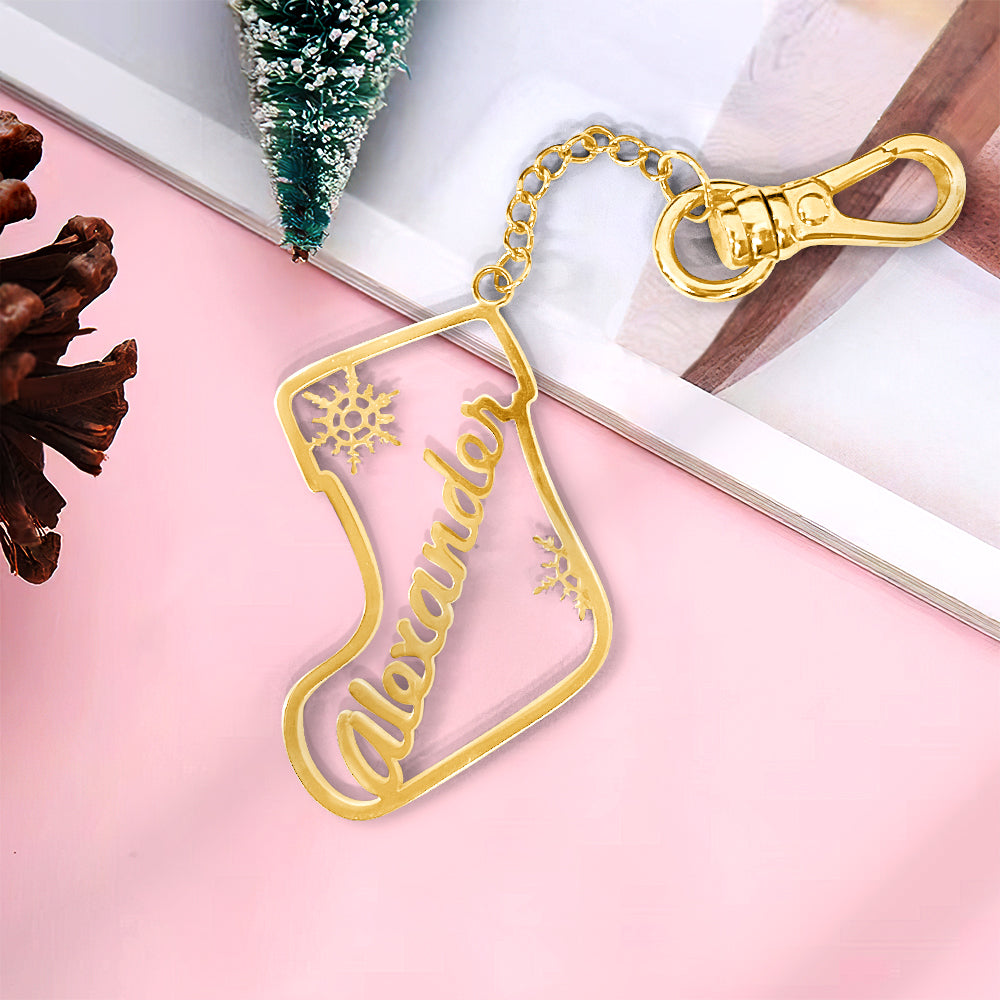 Personalised copper Christmas sock keyring displayed with festive decorations – unique custom name keyring for stocking fillers