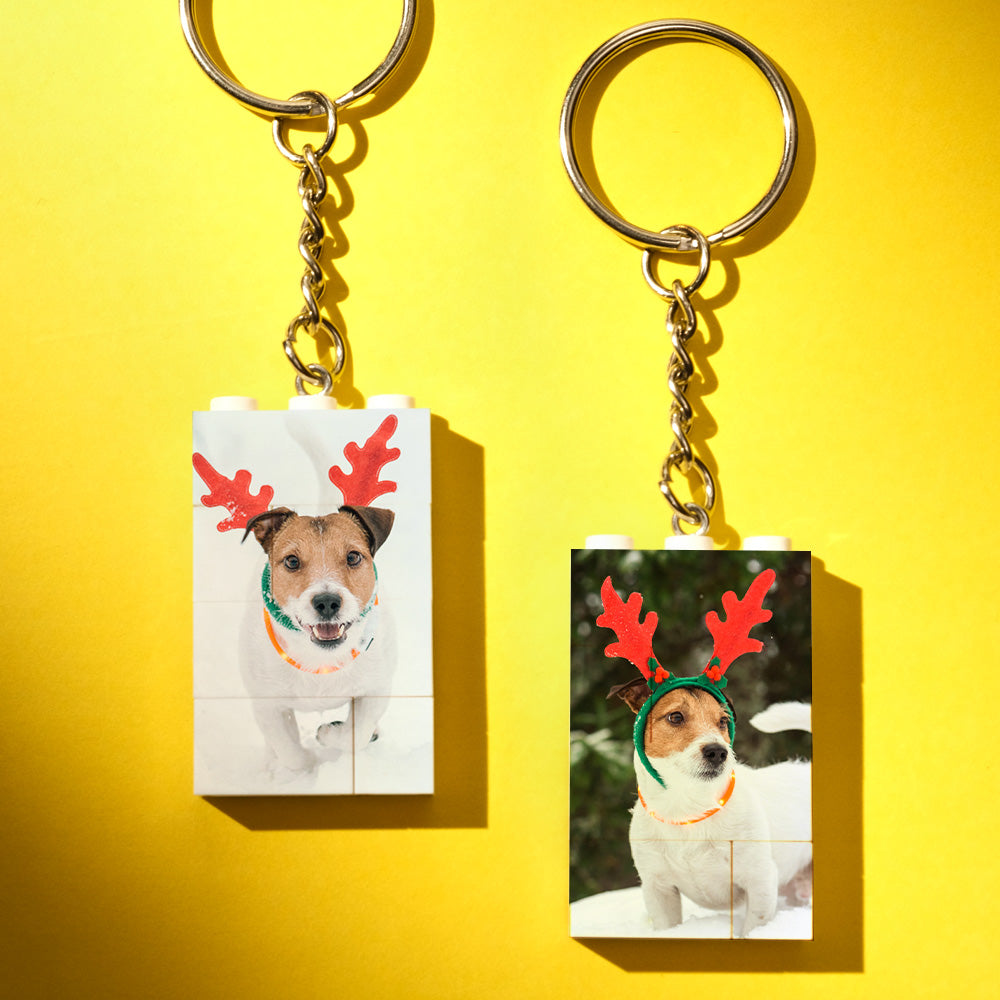 Partially disassembled custom building block keyring showing interlocking bricks and a personalised baby photo