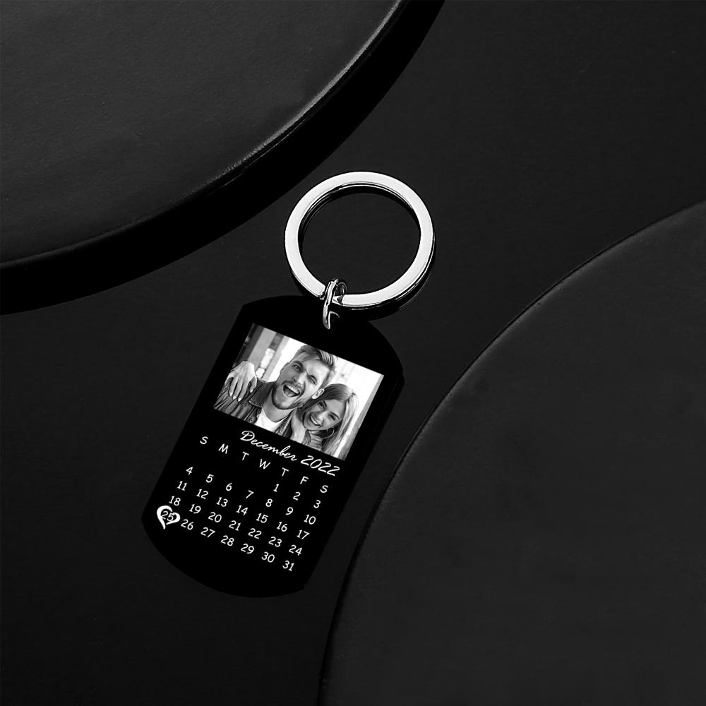 Two personalised photo keyrings displayed together with engraved-style black finish, demonstrating a thoughtful keepsake for anniversaries or memorials.