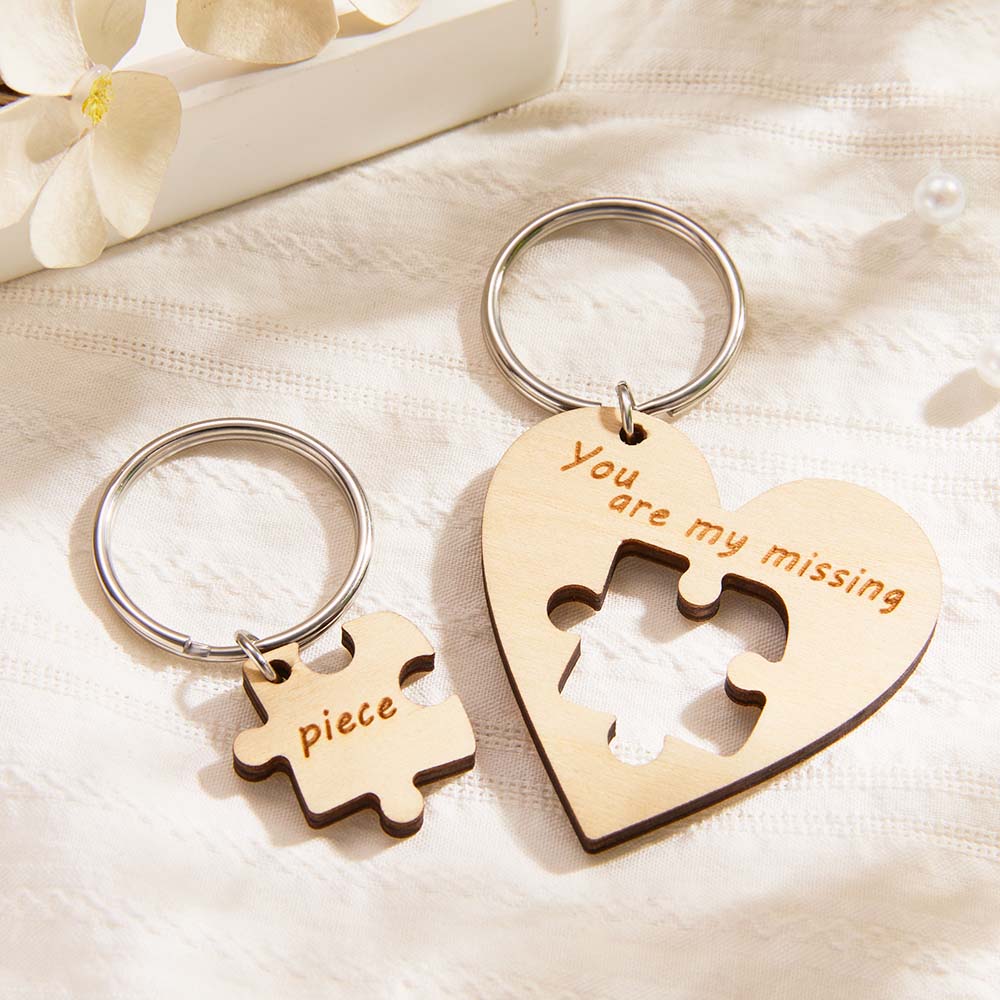 Custom wooden puzzle keyring close-up showing laser-engraved initials and smooth handcrafted finish - personalised keepsake for couples and friends