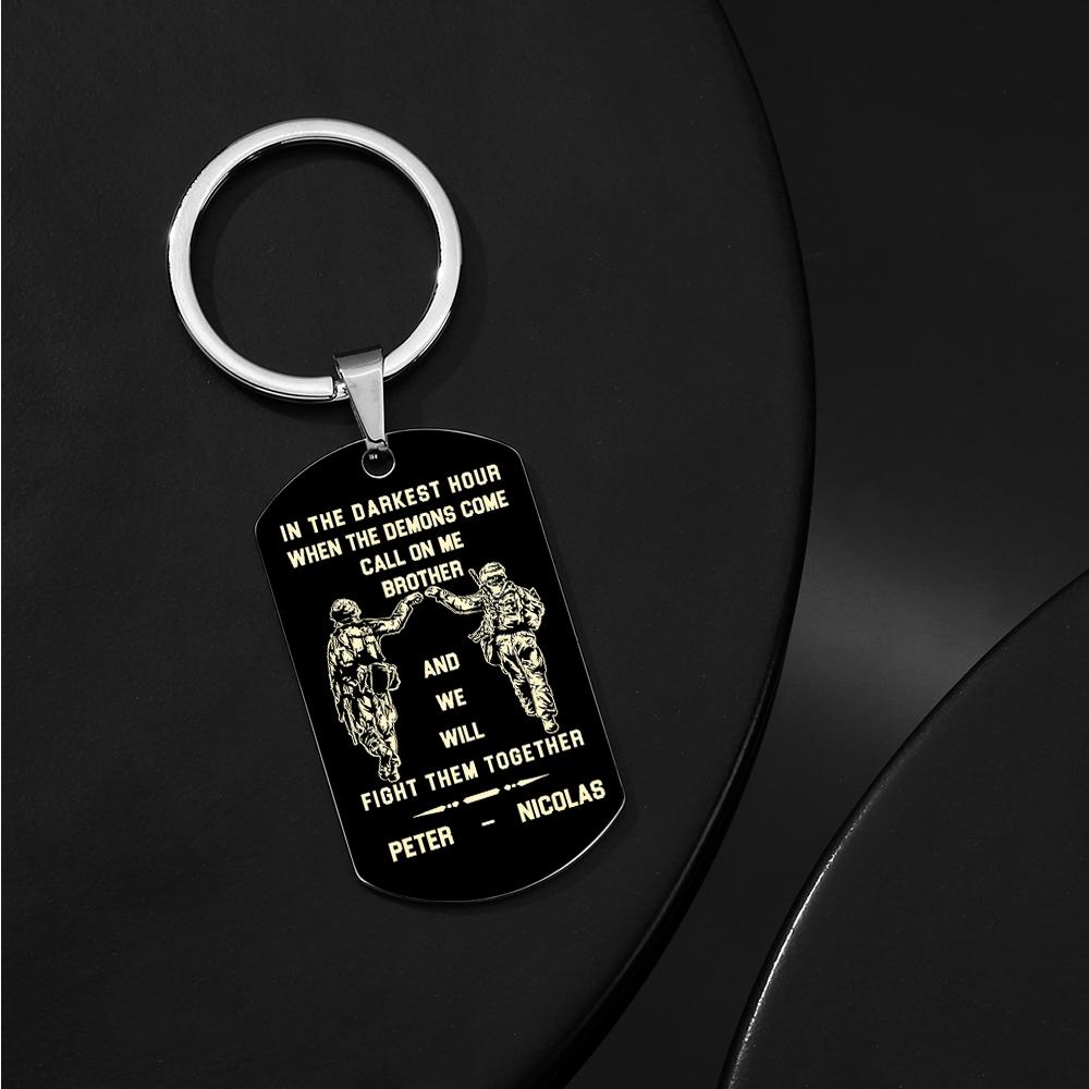 Styled close-up of the personalised stainless steel tag with emphasis on legibility of the engraved reassuring message.