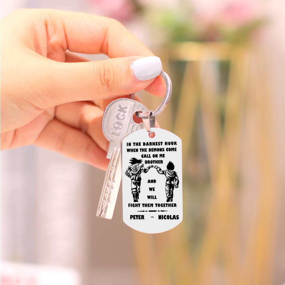 Product displayed on a wooden surface to show contrast and durability of the personalised stainless steel engraved keyring.
