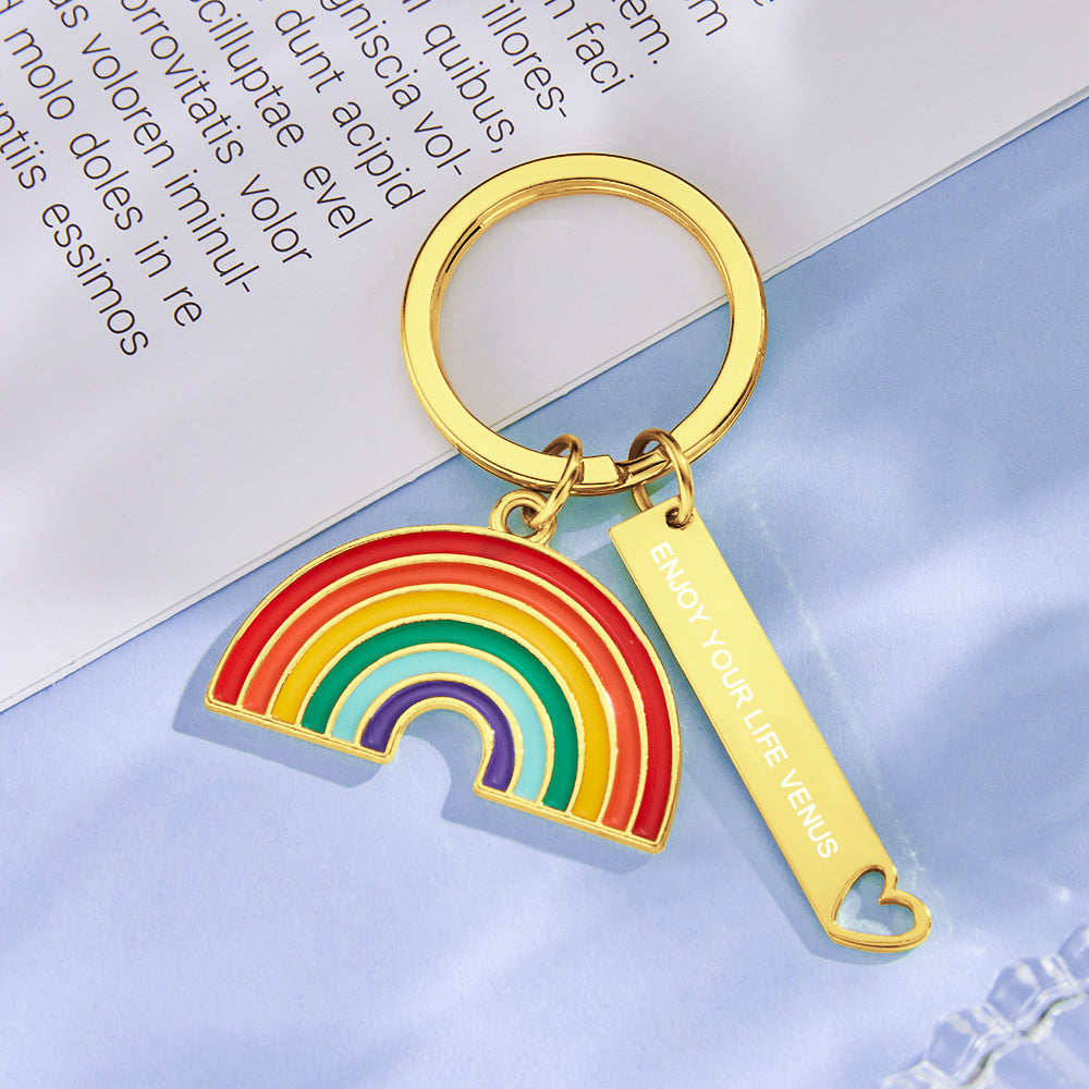 Close-up of sparkly gold rainbow pendant showing bedazzled accents and engraving area – personalised engraved keychain or purse charm