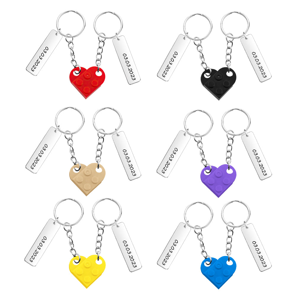 Two personalised couples heart brick keychains displayed together to show matching design and customisation options