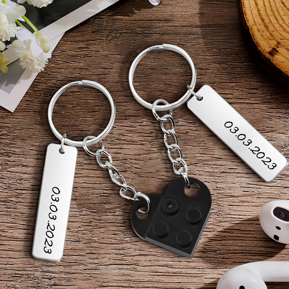 Pair of personalised heart brick keychains presented as a date-matching couples set — perfect sentimental keepsake gift