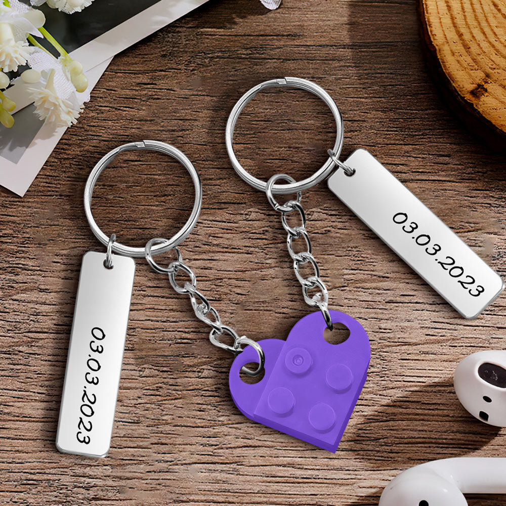Selection of personalised couples heart brick keychains in multiple colour and style combinations for bespoke gifts
