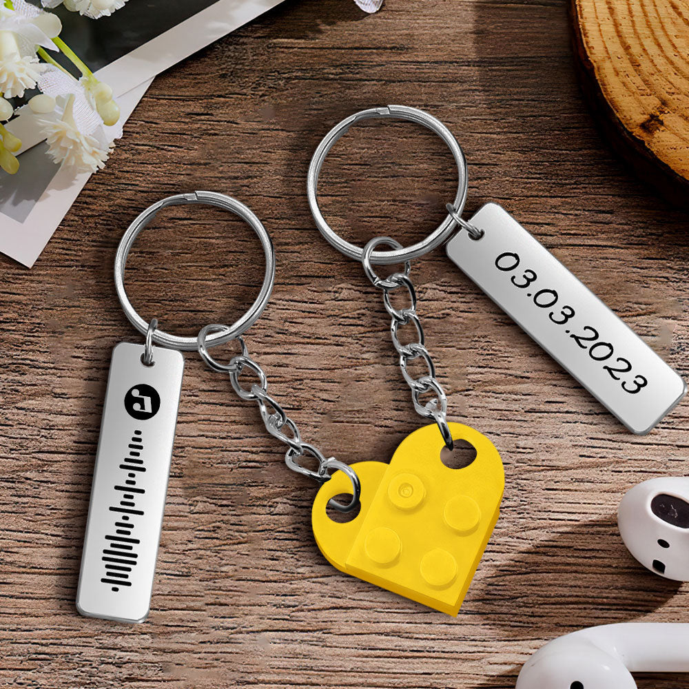Matching set of two heart brick keyrings with complementary engraved halves and personalised names – couples matching keyring set