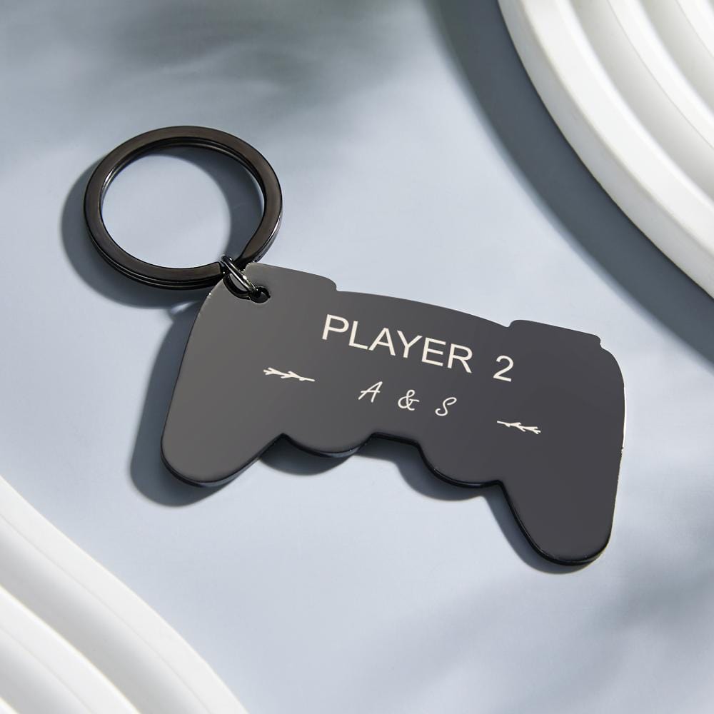 Personalised engraved gamepad keyring attached to a backpack strap — stylish everyday gamer keychain and customised gift idea