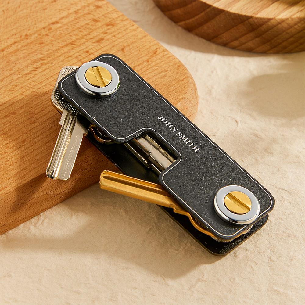 Personalised engraved metal keyring shown on a leather key fob with keys — compact, durable everyday men's accessory and thoughtful groomsmen or husband gift