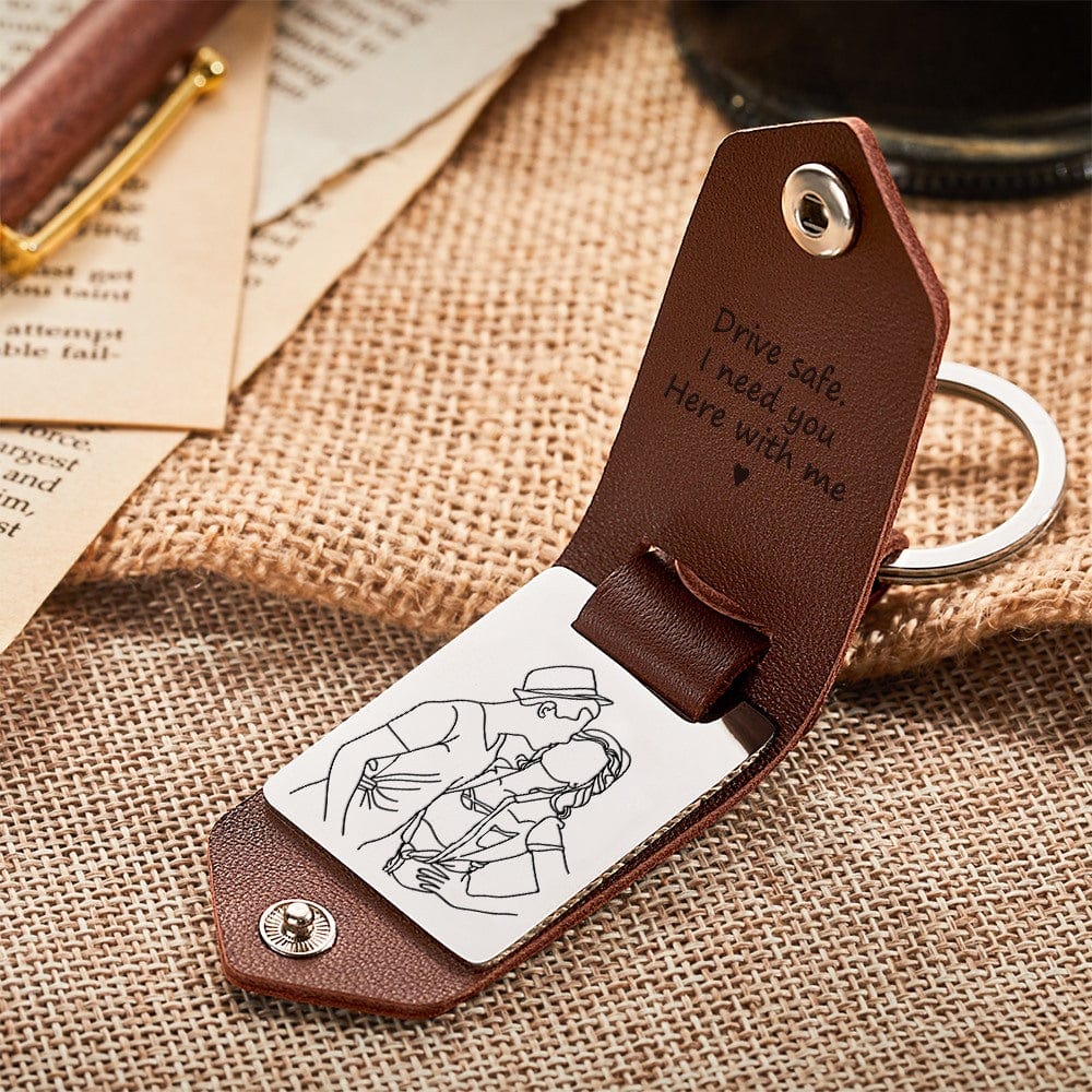 Close‑up of engraved stainless‑steel plate and soft leather strap on a personalised photo keyring — engraved leather keepsake, perfect gift for him