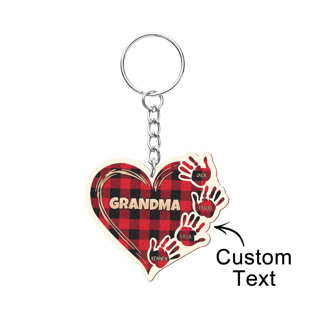 Close-up of personalised wooden hands keychain showing precise laser engraving and natural wood grain detail