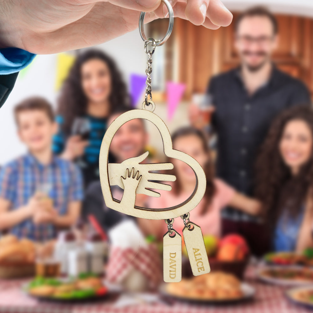 Detail shot of the sturdy keyring and join on a personalised hands name tag, highlighting durability and clean engraved lettering for everyday use