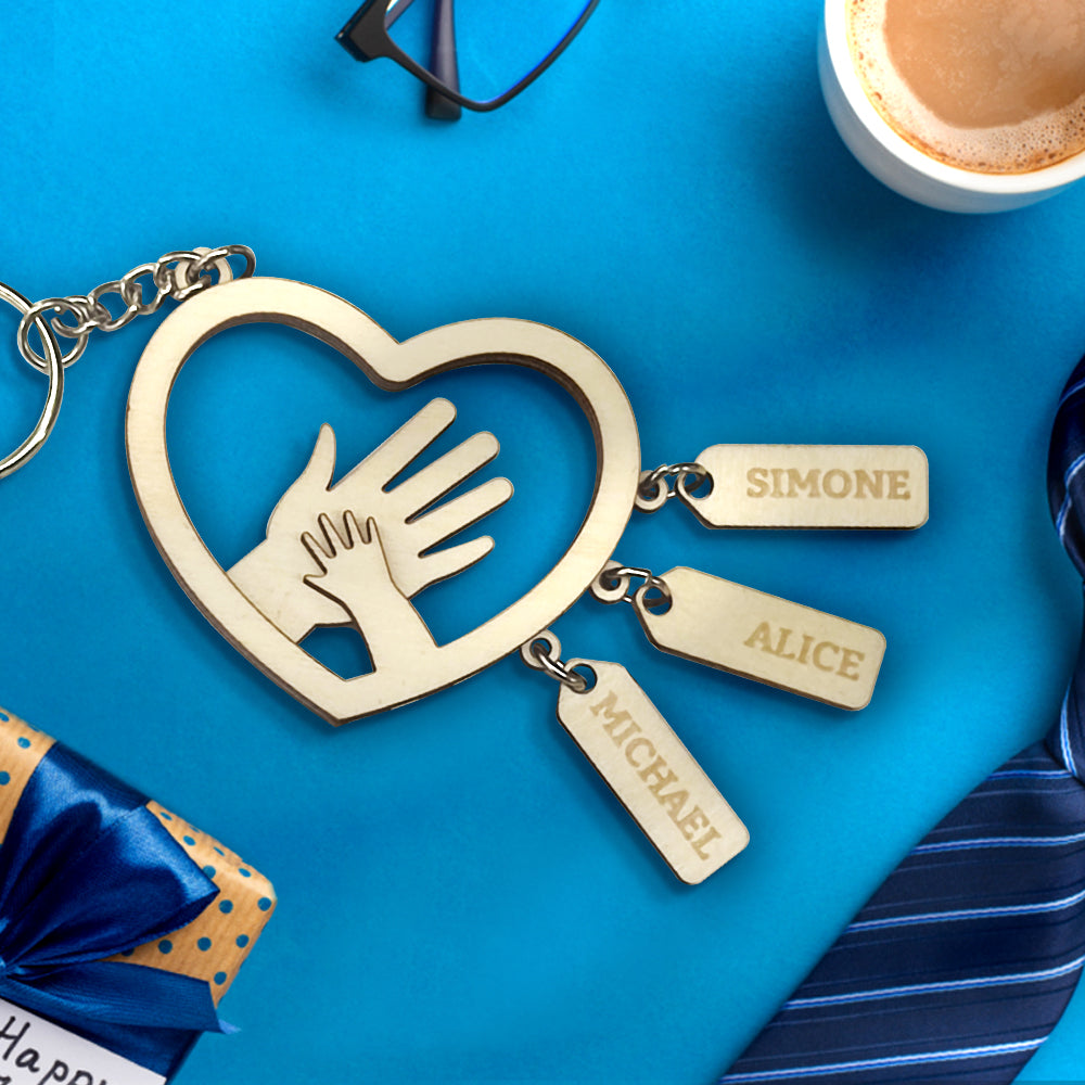Detail shot of the sturdy keyring and join on a personalised hands name tag, highlighting durability and clean engraved lettering for everyday use