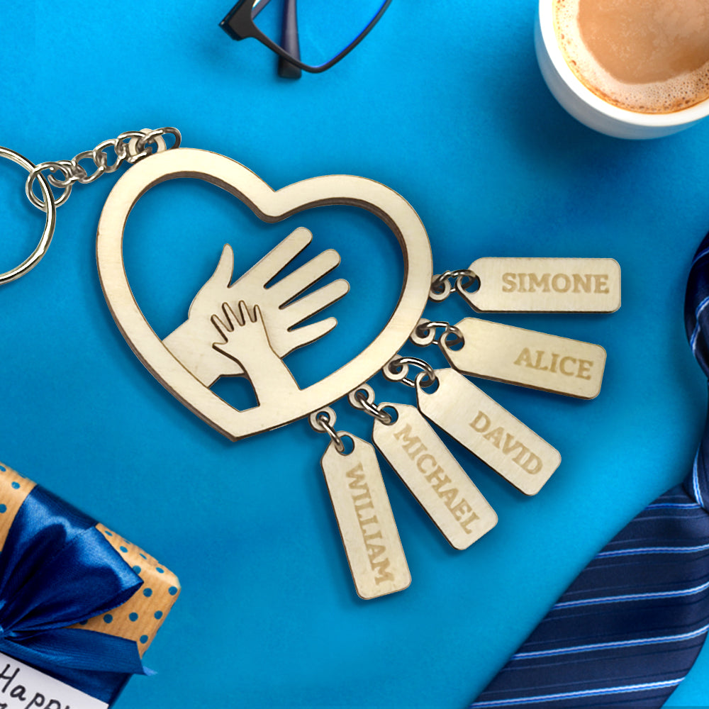 Several personalised hands name tags arranged on a ring to show font, spacing and customisation possibilities – thoughtful personalised gift for grandad or dad