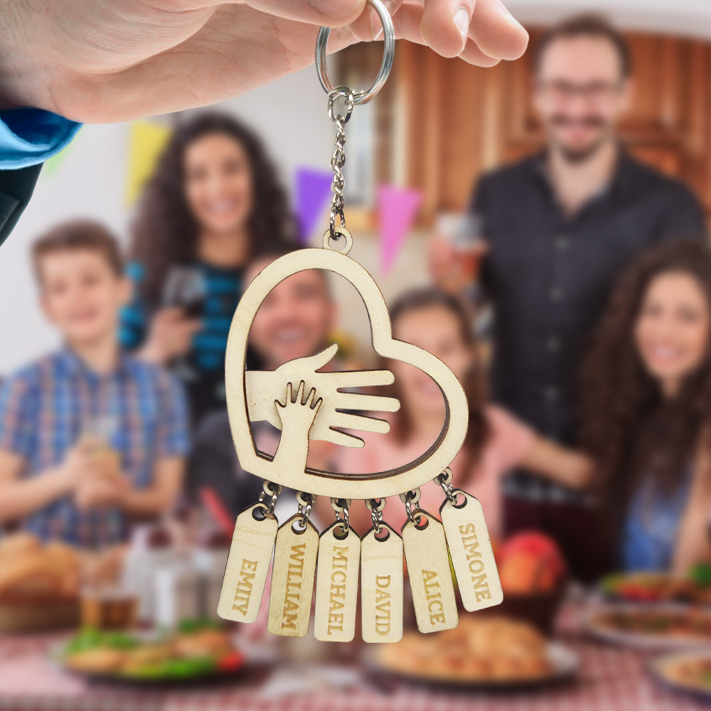 Personalised hands-shaped keychain shown with keys and a bag, engraved names visible – durable, customisable daily reminder and ideal personalised Father's Day gift